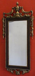 Carved and Giltwood Mirror with Urn and Tassel
