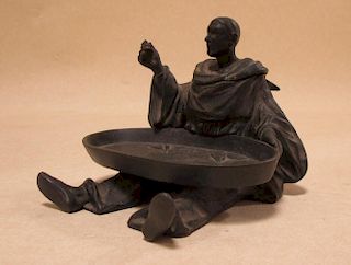 An early 20th century spelter inkwell of a seated scholar with a tray of fish <br> <br>