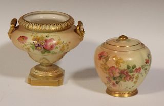 A Royal Worcester blush ivory floral painted urn, with two handles, puce mark 12 dots, 13cm high, wi