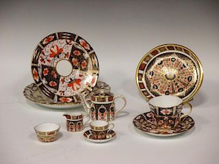 A Royal Crown Derby miniature Imari cabinet set, and a tea cup and saucer and two plates (11) <br> <