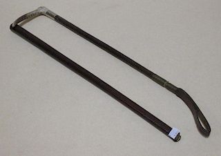 A woven leather bound hunting crop and a riding baton (2) <br> <br>