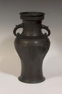 A Japanese bronze vase circa 1900, twin handled, signed to the body, 29.5cm high <br> <br>