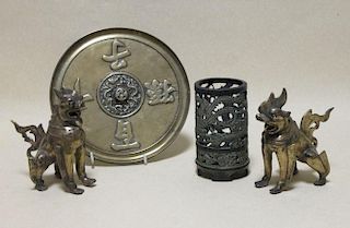A mirror, a pair of Burmese bronze lions and a Chinese bronze vase sleeve, (4) <br> <br>