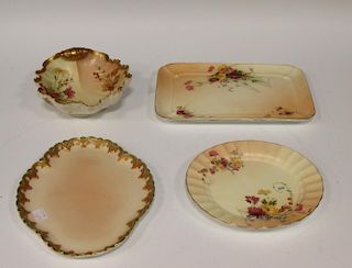 A Royal Worcester shell shaped bowl decorated with flowers, puce mark 12 dots, 19cm long, and three