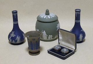 A Wedgwood green jasperware biscuit barrel, two blue jasperware bottle vases, small vase and a boxed