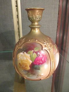 An early 20th century Worcester bottle vase painted with roses, 15.5cm high <br> <br>