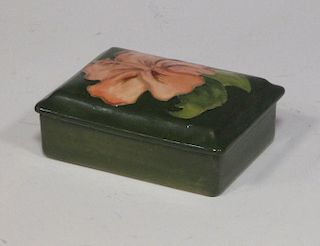 A Moorcroft Hibiscus pattern trinket box, 12cm long <br> <br>