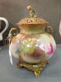 An early 20th century Worcester pot pourri vase and cover painted with roses, 19cm high <br> <br>