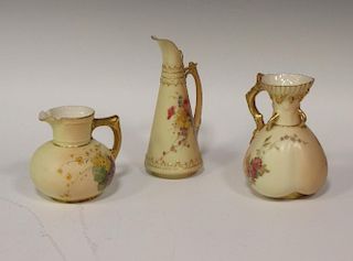 A Royal Worcester blush ivory cleft shaped floral ewer, with conical body, shaped handle, puce mark