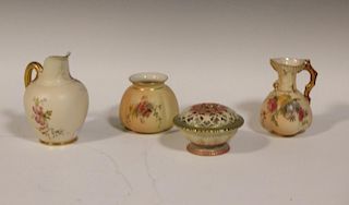 A Worcester blush ivory ground pot pourri vase, a claret jug and two other Worcestershire vases (4)
