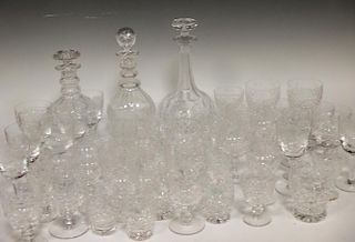 A quantity of cut glasses, and decanters, including several wine glasses with building designs etche