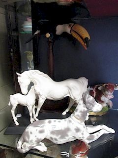 A Richard Roberts toucan, Beswick mare and foal, Staffordshire and Chelsea reclining bull and a Llad