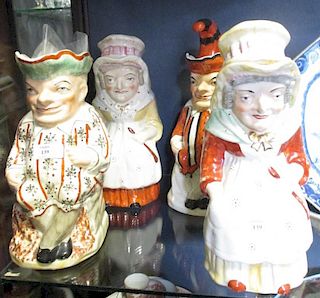 Two pairs of Punch and Judy Staffordshire Toby jugs (4) <br> <br>