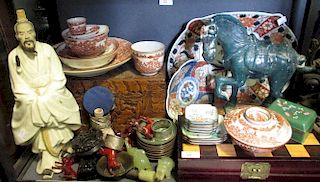 A collection of Chinese ceramics and works of art, including green stone elephants, carved hardwood