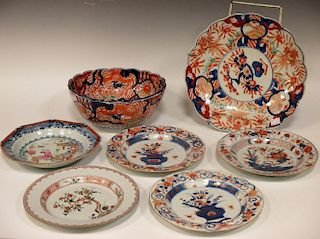 An 18th century Cantonese shallow dish, together with three export imari dishes, an export bowl etc