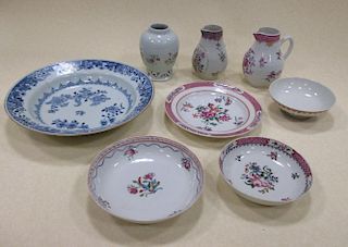 Seven late 18th century Chinese famille rose wares and a blue and white plate (8) <br> <br>