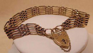 A 9ct gold five bar gate bracelet (18g) <br> <br>