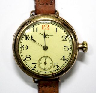 By Waltham - a gold plated gentleman's wristwatch, with white circular dial printed with Arabic nume