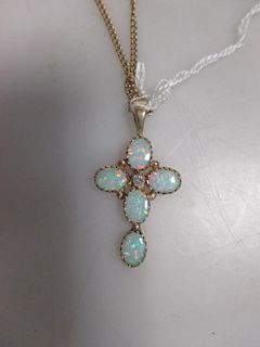 A gold mounted opal cross on chain <br> <br>