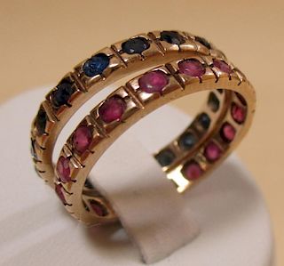 A pair of sapphire and ruby full hoop rings, the small round stones in rubover settings, both set in