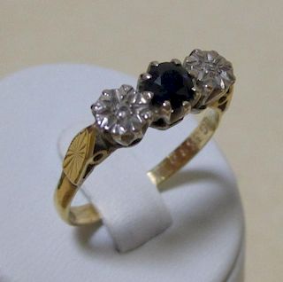 An 18ct sapphire and gypsy set diamond ring, size P and a three stone opal and sapphire cluster ring