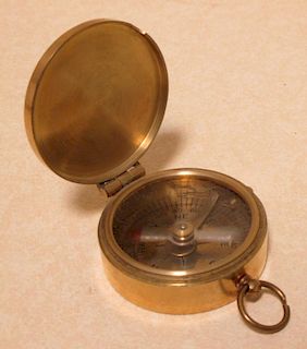 A reproduction brass pocket compass <br> <br>