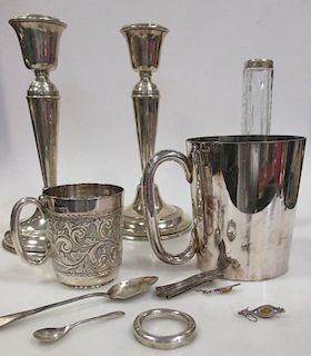 A pair of silver candlesticks (loaded), Birmingham 1918, a silver christening mug, Sheffield 1899 (3