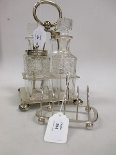 A four piece EPNS cruet and a silver toastrack (2) <br> <br>