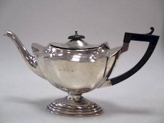A silver tea pot <br> <br>