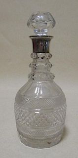 A large cut glass and silver mounted decanter with stopper <br> <br>