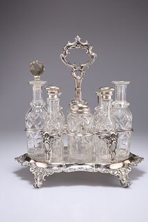 A VICTORIAN SILVER-PLATED EIGHT-BOTTLE CRUET STAND, four bottles with silve