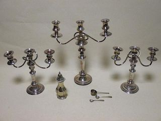 A Pair of electroplated three branch candelabra, and one other similar, a caster and bucket-bowl spo