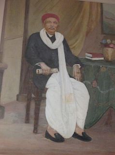 An oil portrait of an Indian dignitary seated <br> <br>