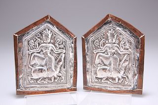 A PAIR OF 19TH CENTURY BURMESE SILVER PLAQUES, each depicting a goddess, mo