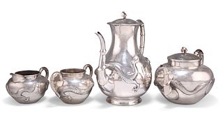 A CHINESE SILVER FOUR-PIECE TEA SERVICE, comprising teapot, coffee pot, cre