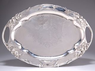 A CONTINENTAL SILVER TRAY, shaped oval, repousse with stylised foliage and 