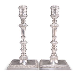 A PAIR OF GEORGE III STYLE CAST SILVER CANDLESTICKS,?by?C J Vander Ltd, Lon