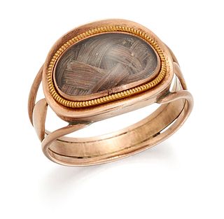 A HAIRWORK MEMORIAL RING, an oval plaque containing a lover's knot of hair 
