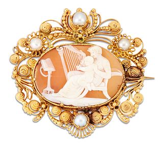 A 19TH CENTURY SHELL CAMEO BROOCH, carved depicting a seated mother and inf