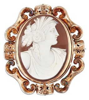 A VICTORIAN SHELL CAMEO AND HAIRWORK BROOCH, carved depicting the bust of C