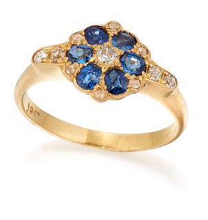 A SAPPHIRE AND DIAMOND CLUSTER RING, an old-cut diamond within a border of 