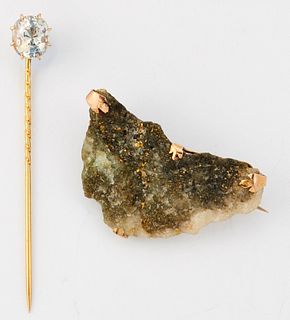A ROCK CRYSTAL STICK PIN, a cushion-cut rock crystal in a claw setting, 2.6