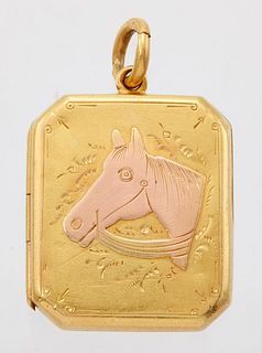 A LOCKET PENDANT, the rectangular locket with canted corners, the front wit