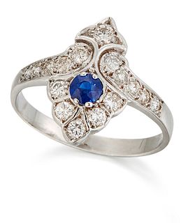 A SAPPHIRE AND DIAMOND RING, a round-cut sapphire to an aigrette motif set 