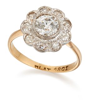 A DIAMOND CLUSTER RING, an old-cut diamond within a border of milgrain set 