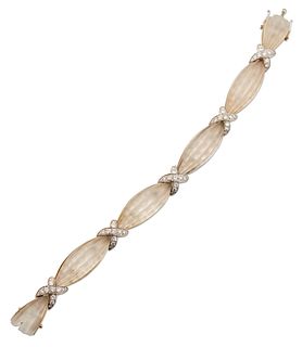 A ROCK CRYSTAL AND DIAMOND BRACELET, fluted lozenge shaped frosted rock cry