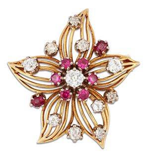 A RUBY AND DIAMOND FLOWER BROOCH, CIRCA 1950S, the stylised flowerhead with