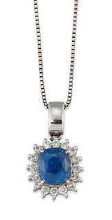 A SAPPHIRE AND DIAMOND CLUSTER PENDANT ON CHAIN, a cushion-cut sapphire in 