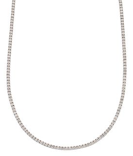 A DIAMOND LINE NECKLACE, round brilliant-cut diamonds in claw settings as a