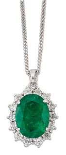 AN 18 CARAT WHITE GOLD EMERALD AND DIAMOND CLUSTER PENDANT ON CHAIN,?an ova